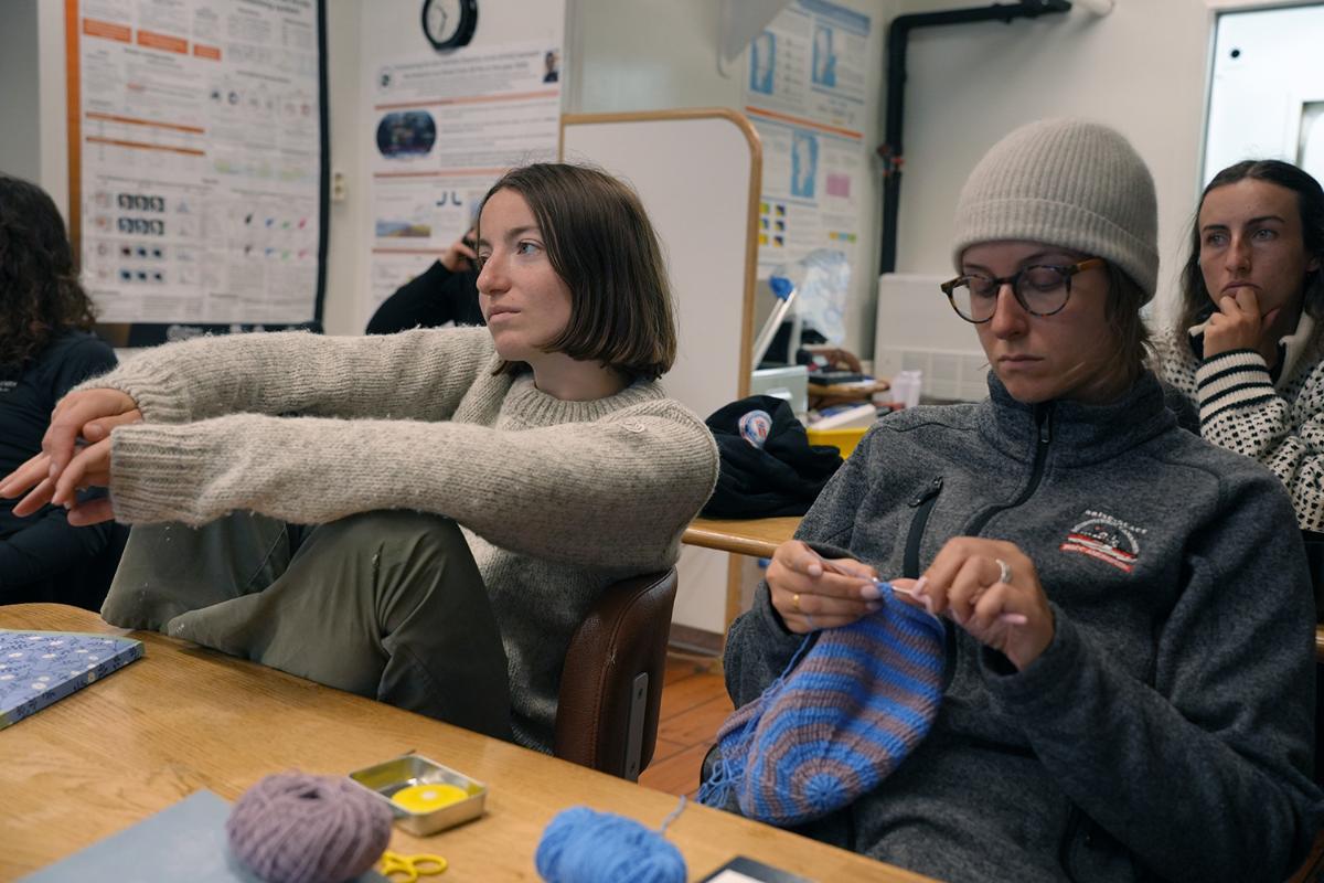 Two persons looking the same direction